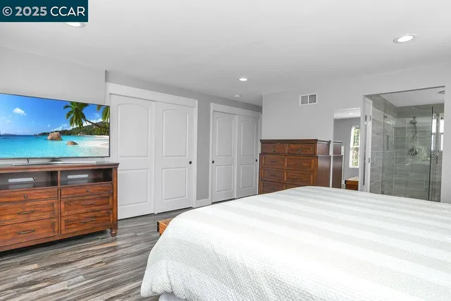 a bathroom with a shower sink and mirror