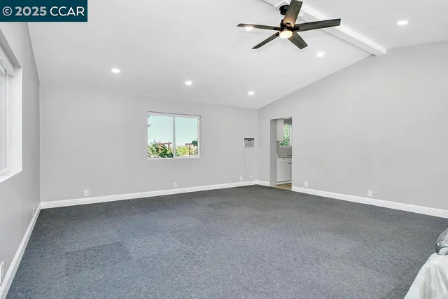 a kitchen with granite countertop white cabinets and a sink