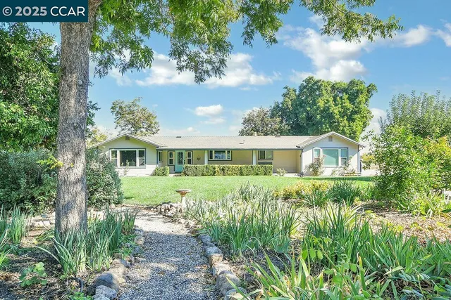 a view of a wooden bench sitting in front of a door