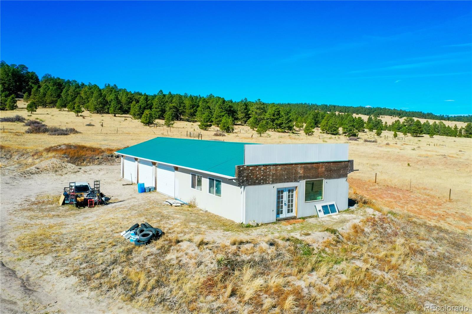 21045 Roxie Ridge View Peyton, CO 80831 - Photo 2 of 28 a view of a house with a yard