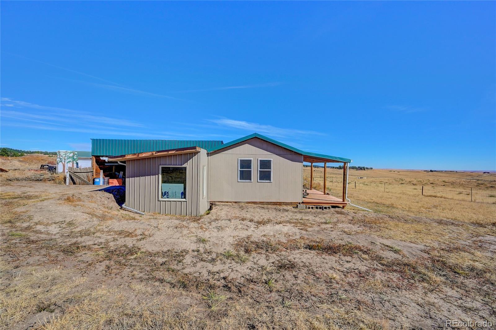 21045 Roxie Ridge View Peyton, CO 80831 - Photo 5 of 28 a view of a house with a yard