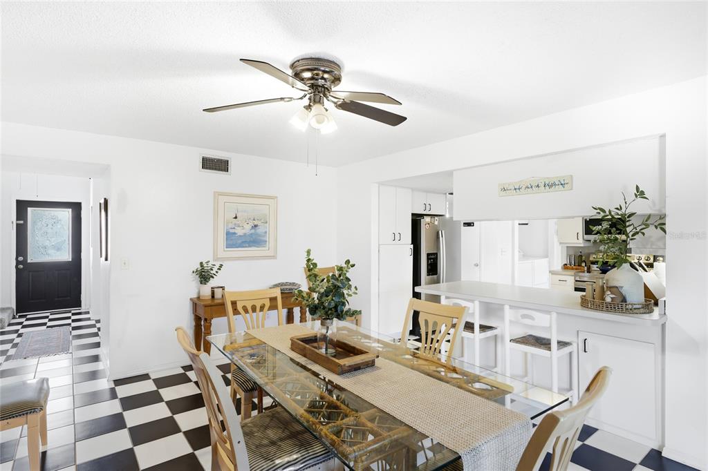 212 85th Street Holmes Beach, FL 34217 - Photo 11 of 45 a living room with furniture and a flat screen tv