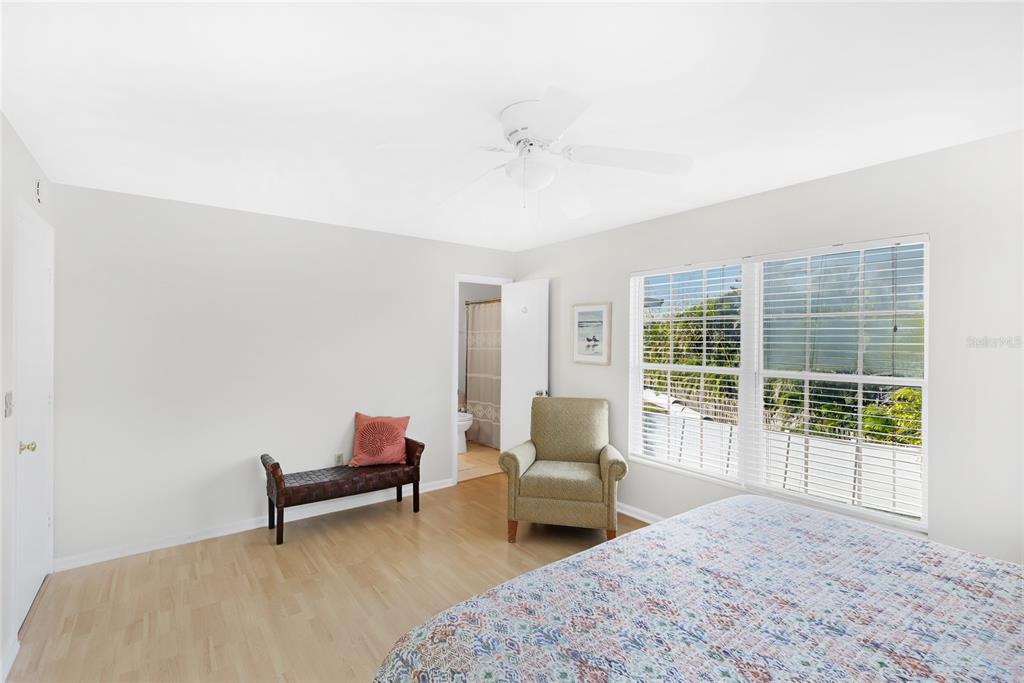 212 85th Street Holmes Beach, FL 34217 - Photo 21 of 45 a living room with furniture and a window