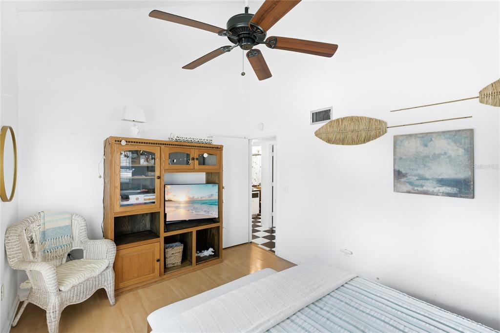 212 85th Street Holmes Beach, FL 34217 - Photo 24 of 45 a bedroom with furniture and a window