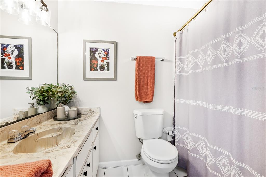 212 85th Street Holmes Beach, FL 34217 - Photo 26 of 45 a bathroom with a sink toilet and shower