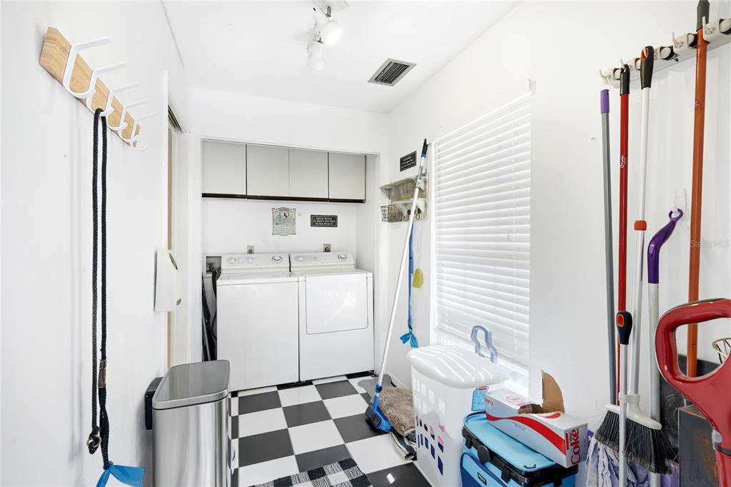 212 85th Street Holmes Beach, FL 34217 - Photo 31 of 45 a room with furniture and a window