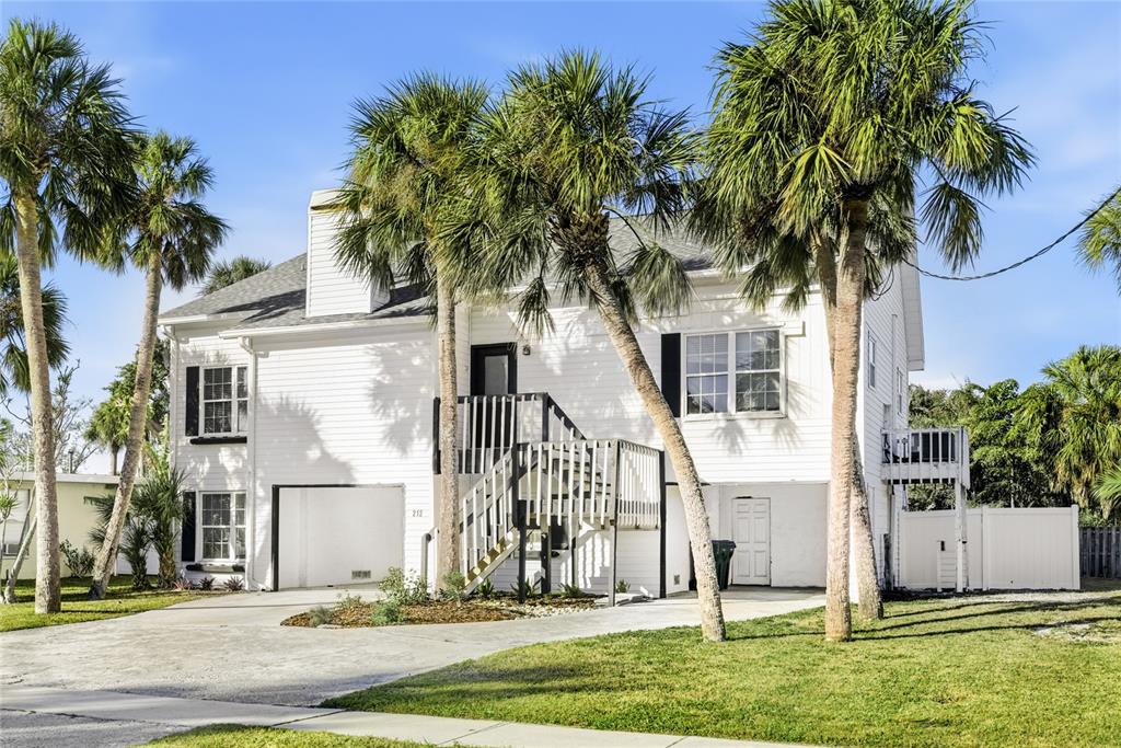 212 85th Street Holmes Beach, FL 34217 - Photo 35 of 45 a front view of house with yard