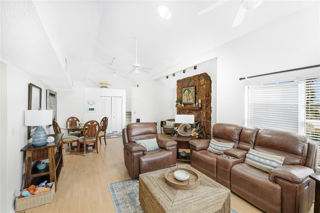 212 85th Street Holmes Beach, FL 34217 - Photo 4 of 45 a living room with furniture and wooden floor
