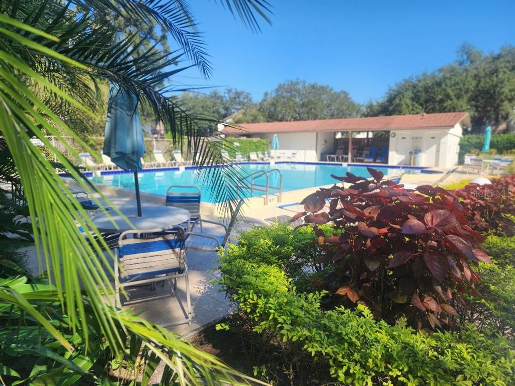 a backyard of a house with outdoor seating
