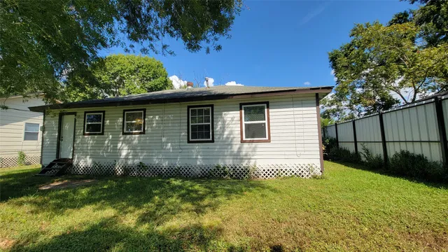a backyard of a house with lots of green space