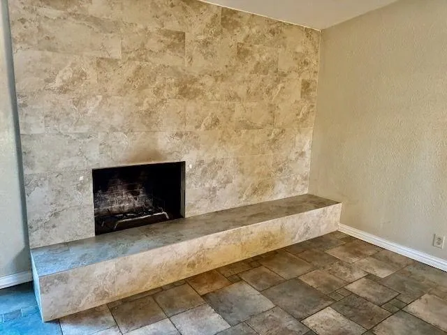 a living room with a fireplace
