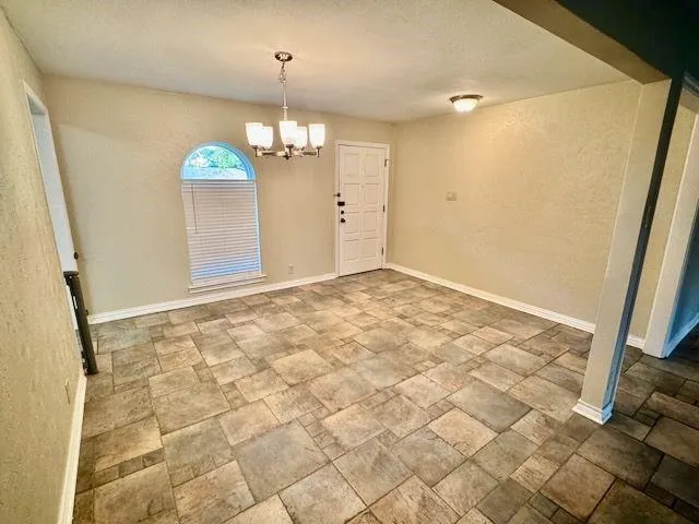 a view of an empty room and window