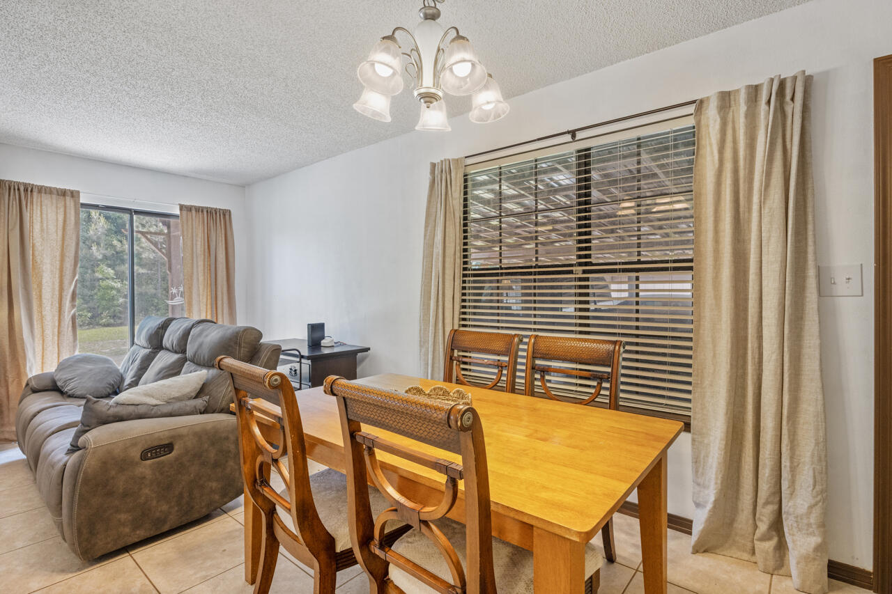 7151 Wallace Drive Pace, FL 32571 - Photo 11 of 40 a bedroom with furniture and windows