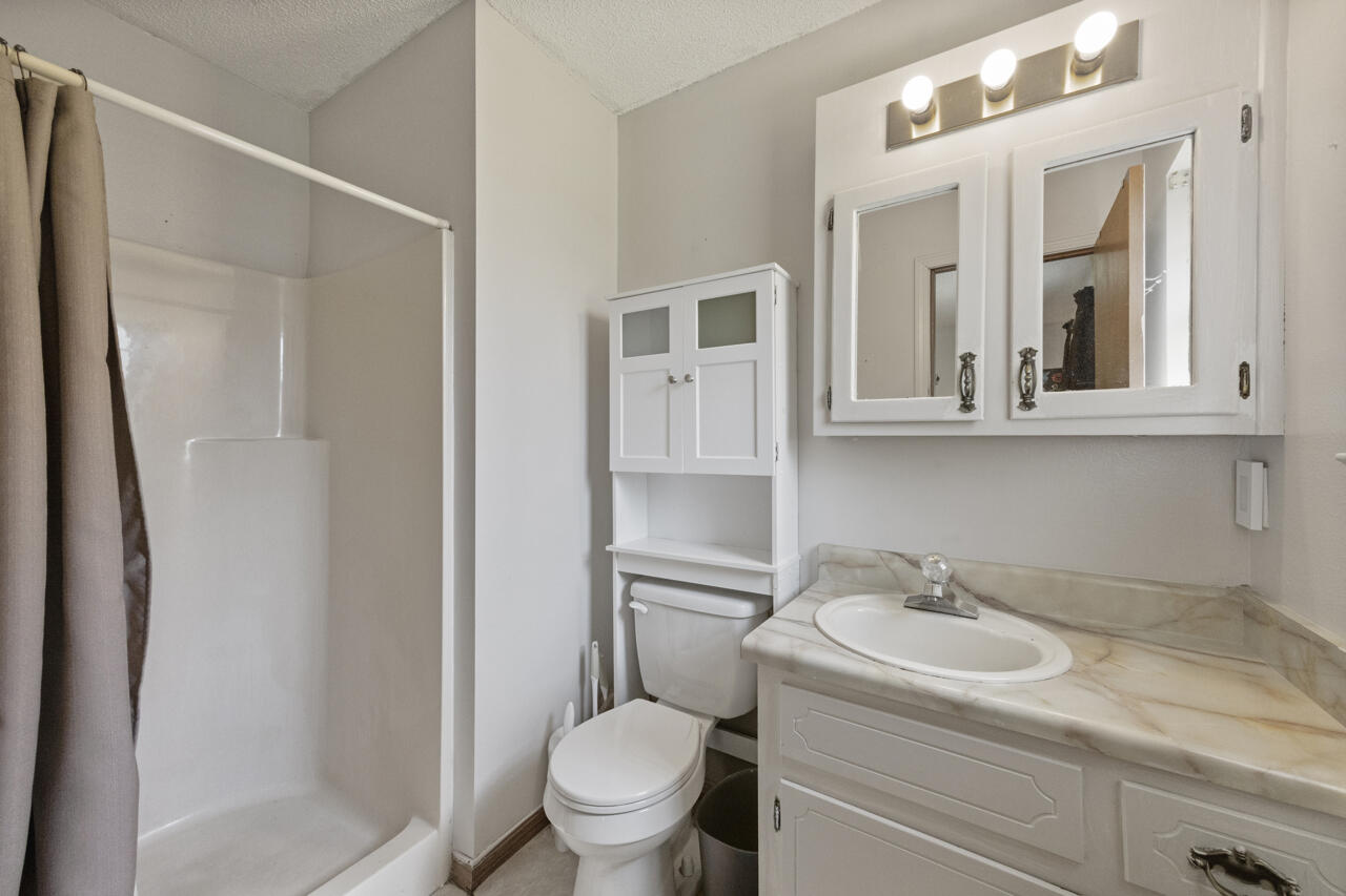 7151 Wallace Drive Pace, FL 32571 - Photo 20 of 40 a bathroom with a sink toilet and shower