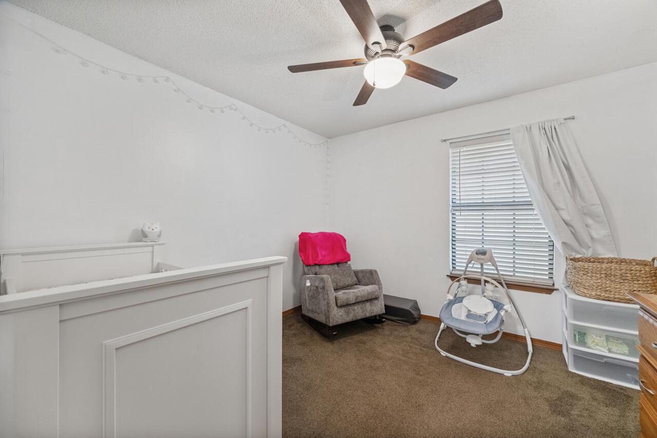 7151 Wallace Drive Pace, FL 32571 - Photo 23 of 40 a room with a window and gym equipment