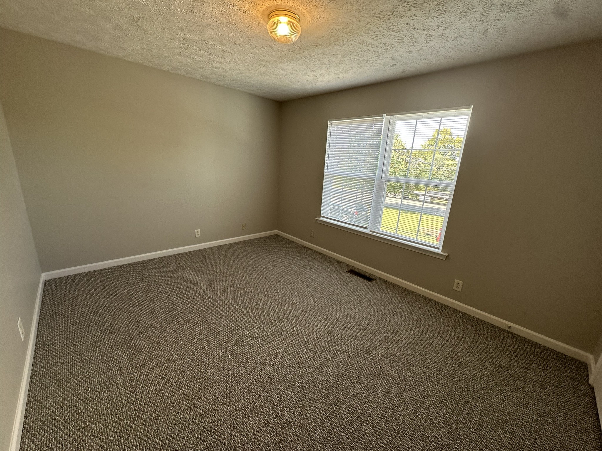 2328 Willowbrook Drive, Unit C Murfreesboro, TN 37130 - Photo 11 of 13 an empty room with a window