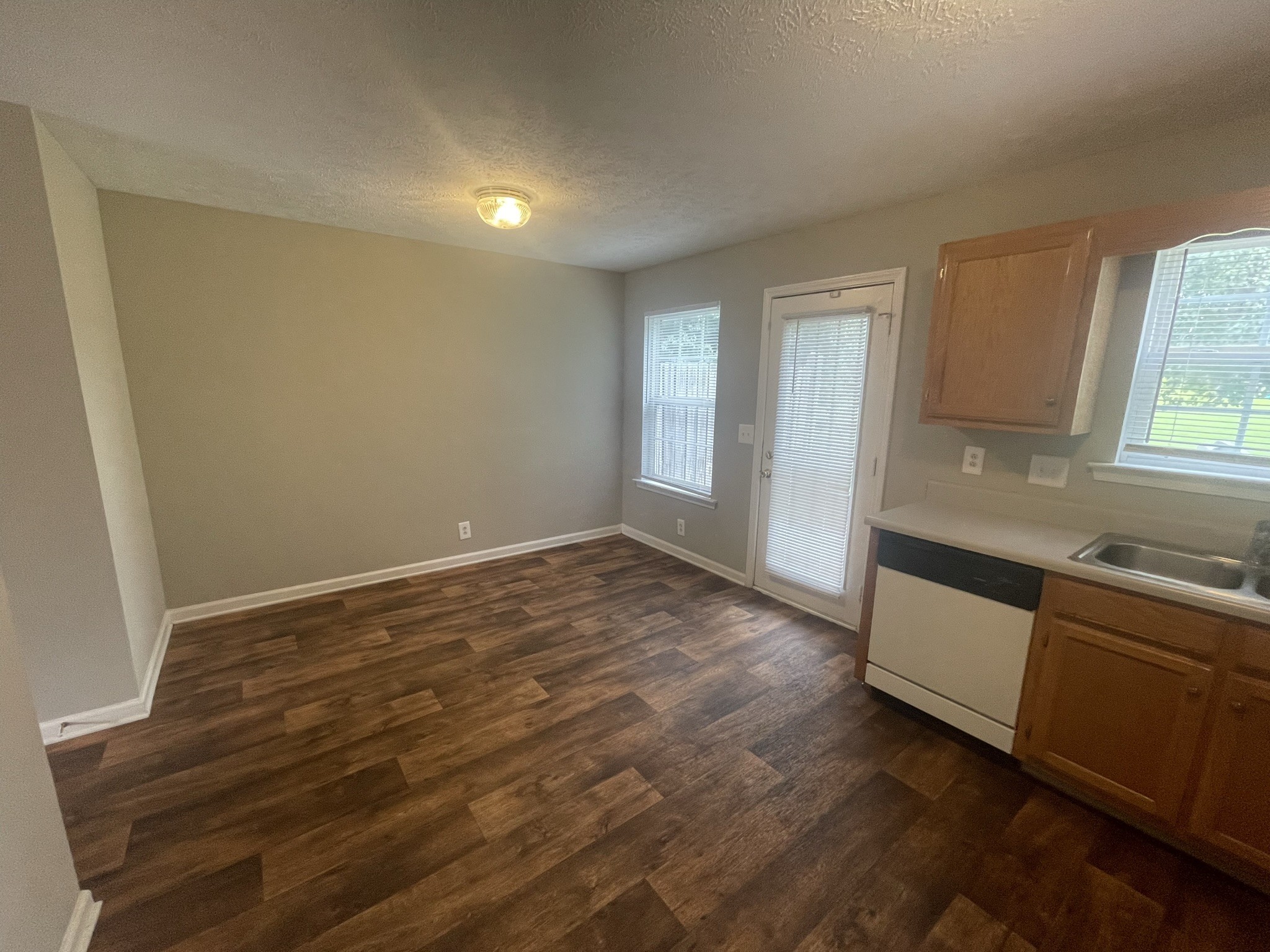 2328 Willowbrook Drive, Unit C Murfreesboro, TN 37130 - Photo 5 of 13 a view of an empty room with wooden floor and a window