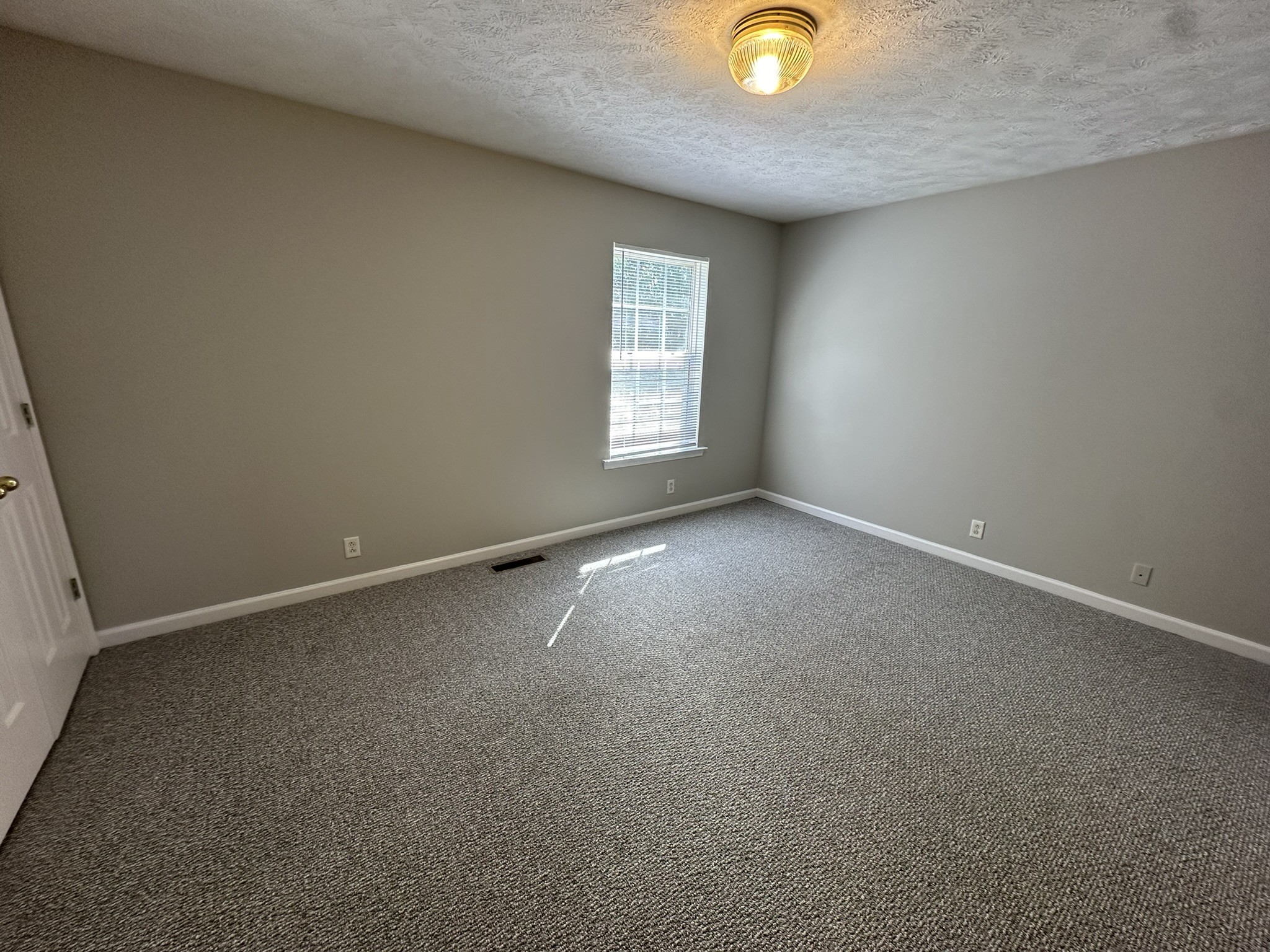 2328 Willowbrook Drive, Unit C Murfreesboro, TN 37130 - Photo 8 of 13 an empty room with windows and window