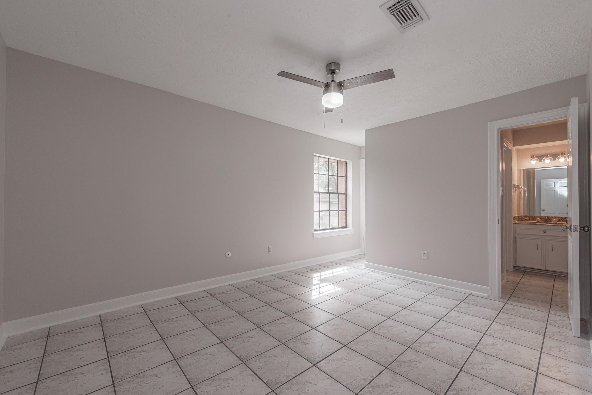 8019 Beaufort Drive Spring, TX 77379 - Photo 23 of 47 a view of an empty room with a window