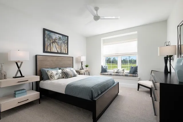 a bedroom with a bed and a night stand