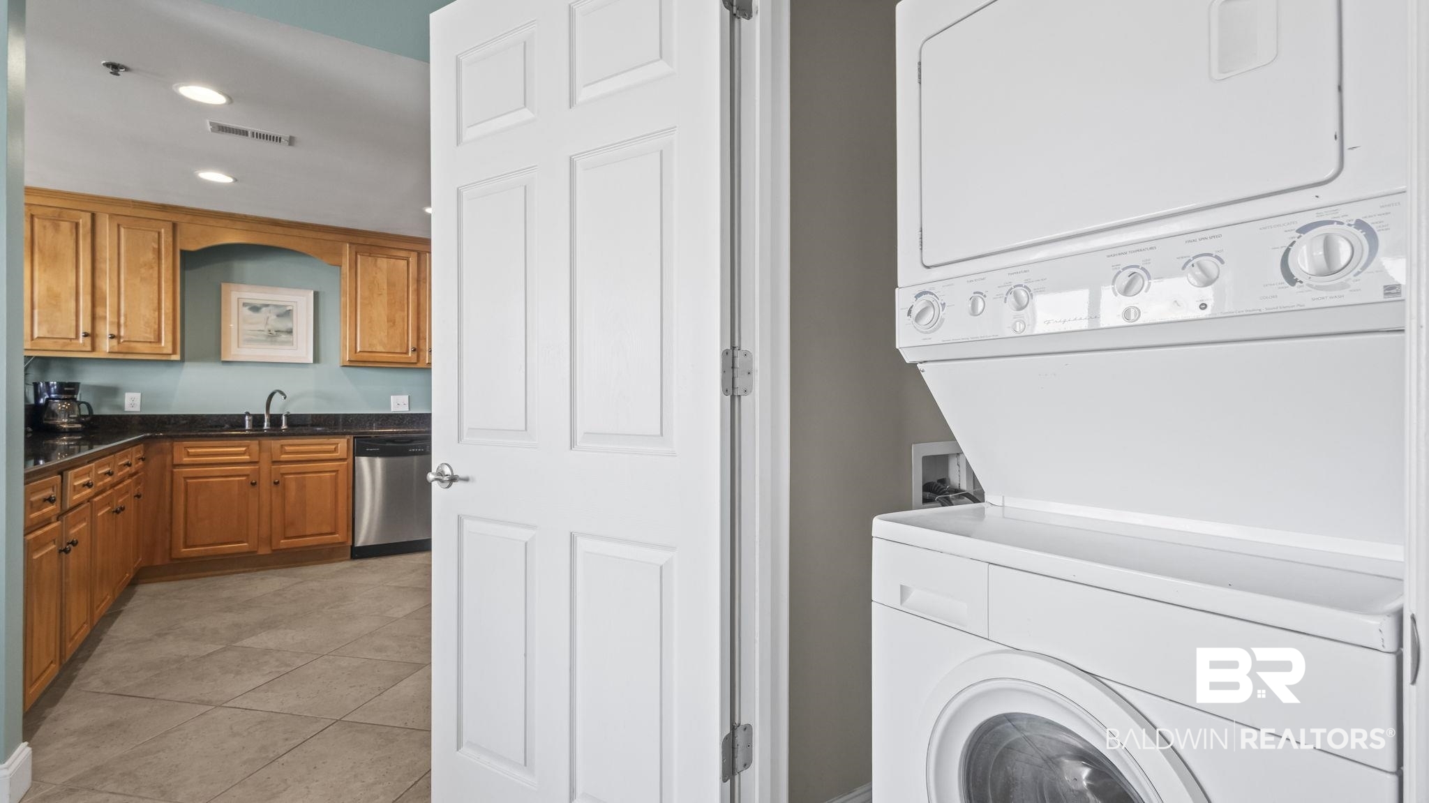 25909 Canal Road, Unit 203 Orange Beach, AL 36561 - Photo 31 of 36 Laundry area featuring stacked washer / dryer, light tile patterned floors, and recessed lighting