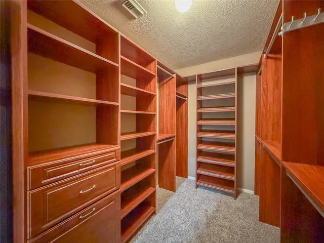 a bathroom with a tub a sink and a mirror