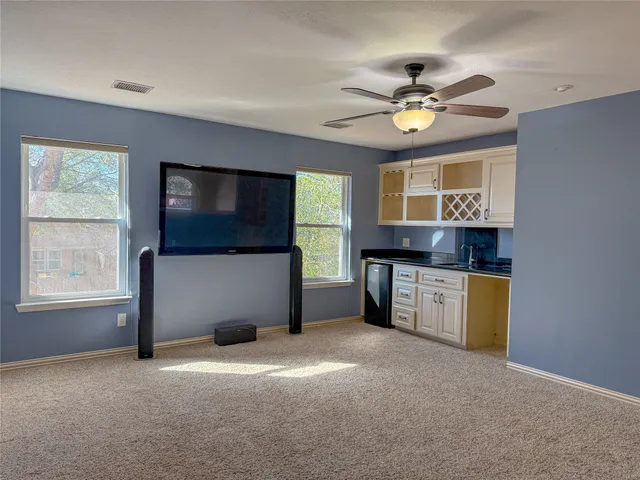 a kitchen with stainless steel appliances granite countertop a sink and cabinets