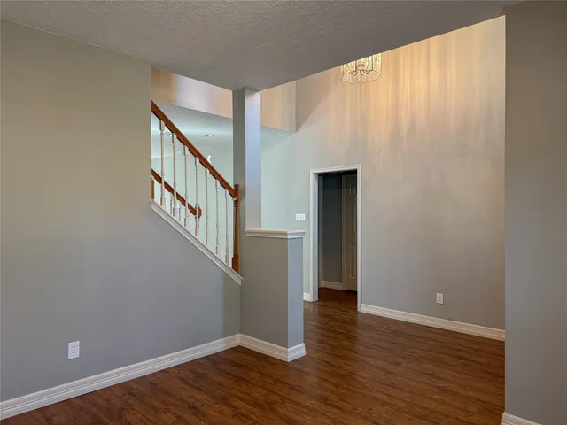 a view of an entryway with wooden floor