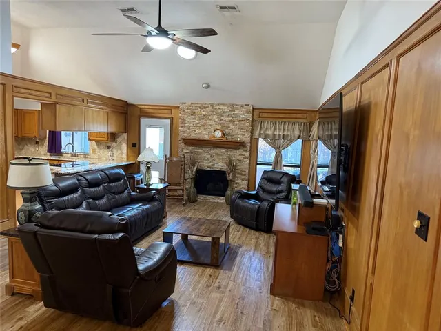 a living room with furniture fireplace and a flat screen tv