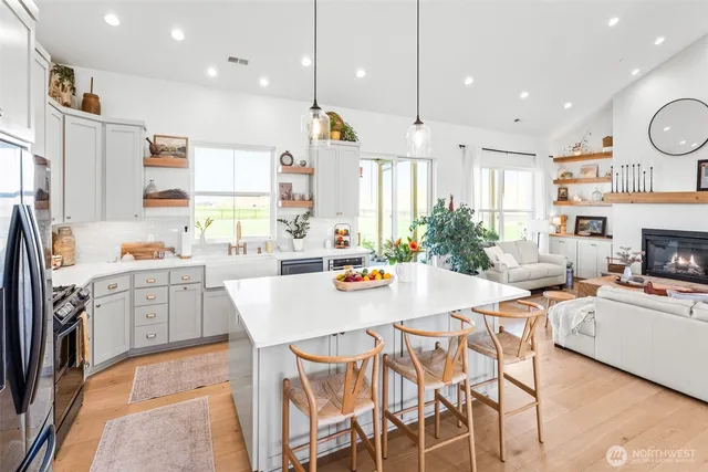 a large kitchen with a table and chairs in it