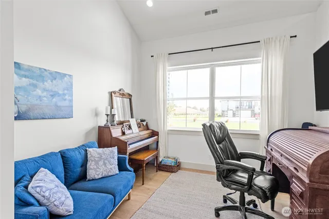 a living room with furniture and a window