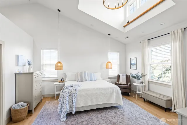 a bedroom with a bed couch and window