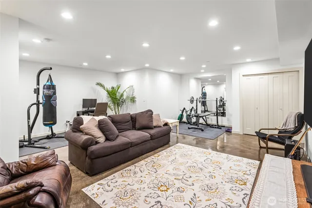 a living room with furniture and a rug