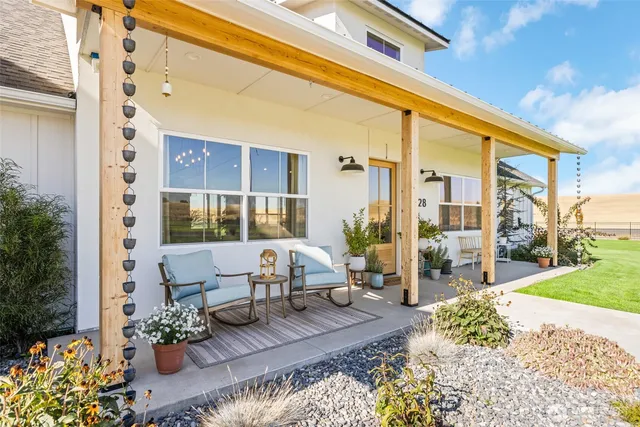 a balcony with furniture and flowers