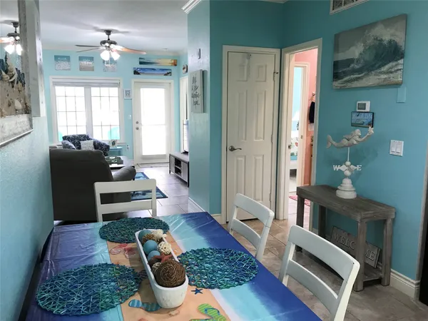 a bedroom with a bed and a wall painting