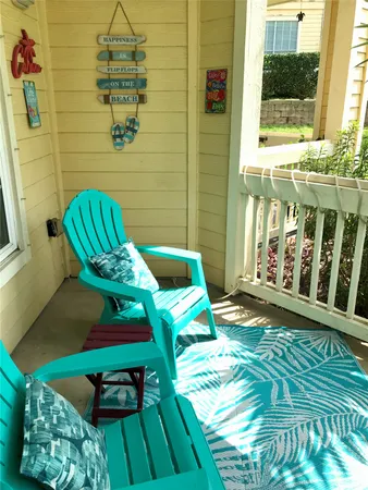 a view of a chairs and table in patio