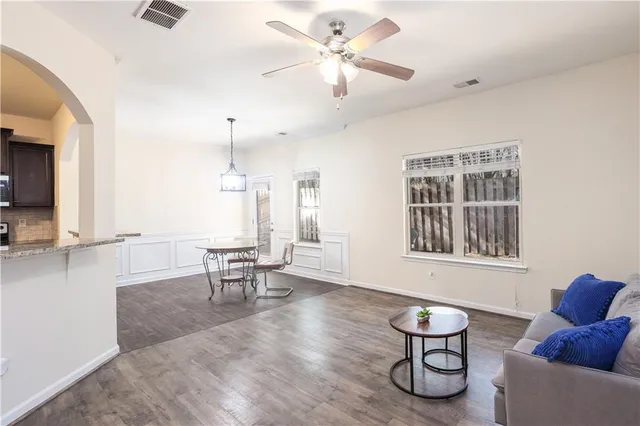 a view of a livingroom with furniture and windows