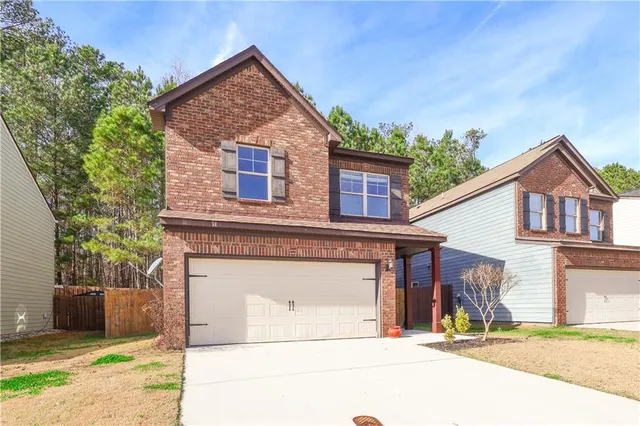 front view of a house with a street