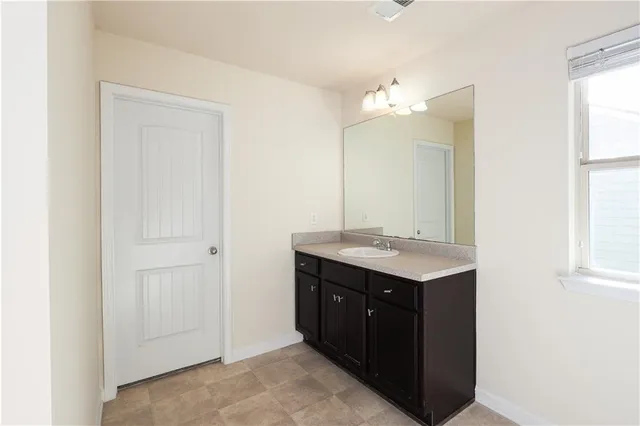 a bathroom with a shower curtain and a shower curtain
