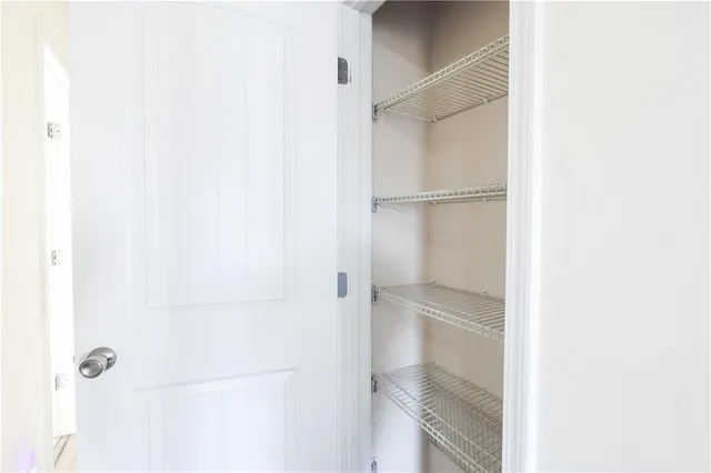 a patio with a table and chairs under an umbrella