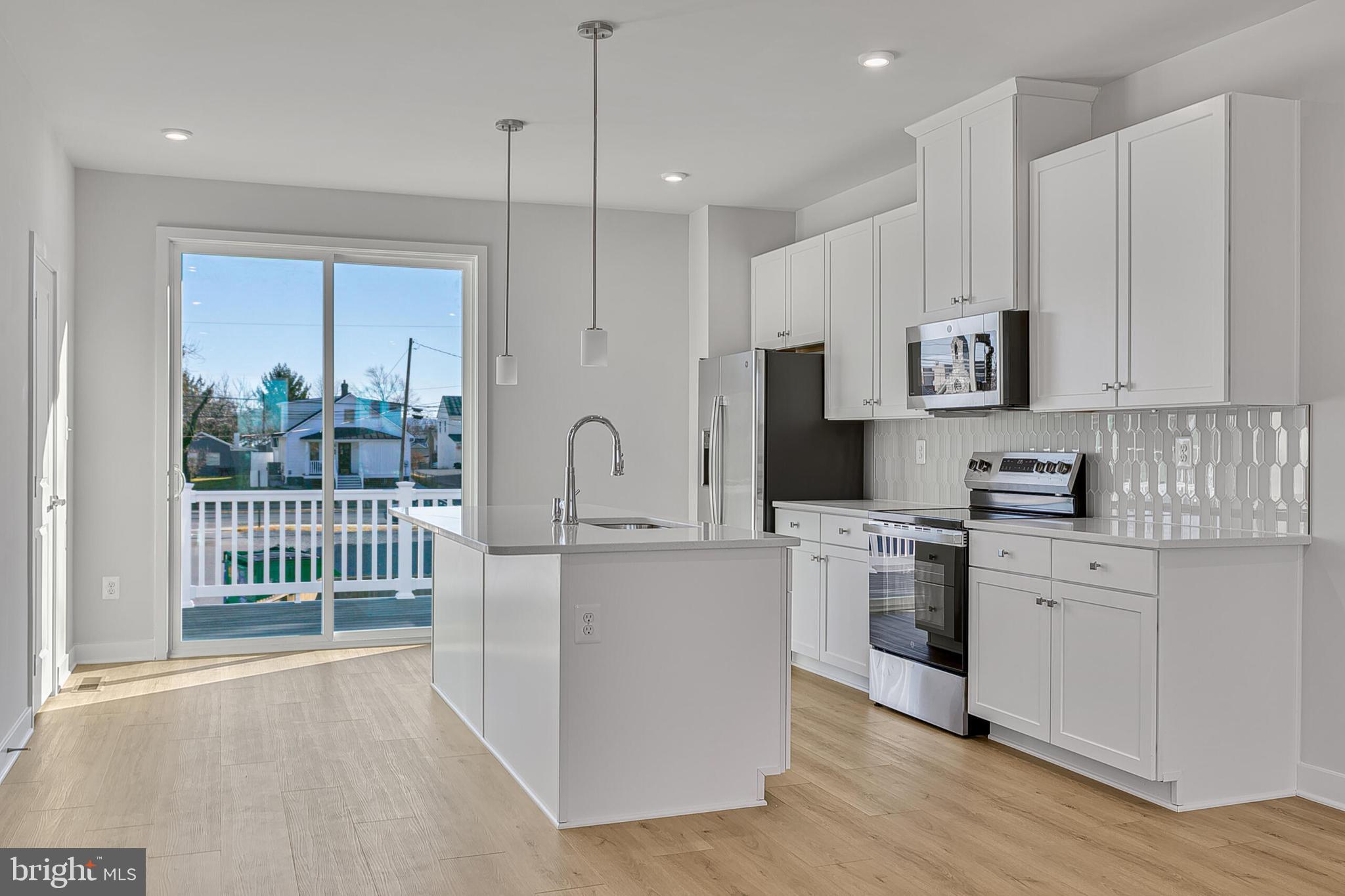 1 B Oasis Avenue Ranson, WV 25438 - Photo 15 of 39 a kitchen with stainless steel appliances granite countertop a stove a sink and a refrigerator