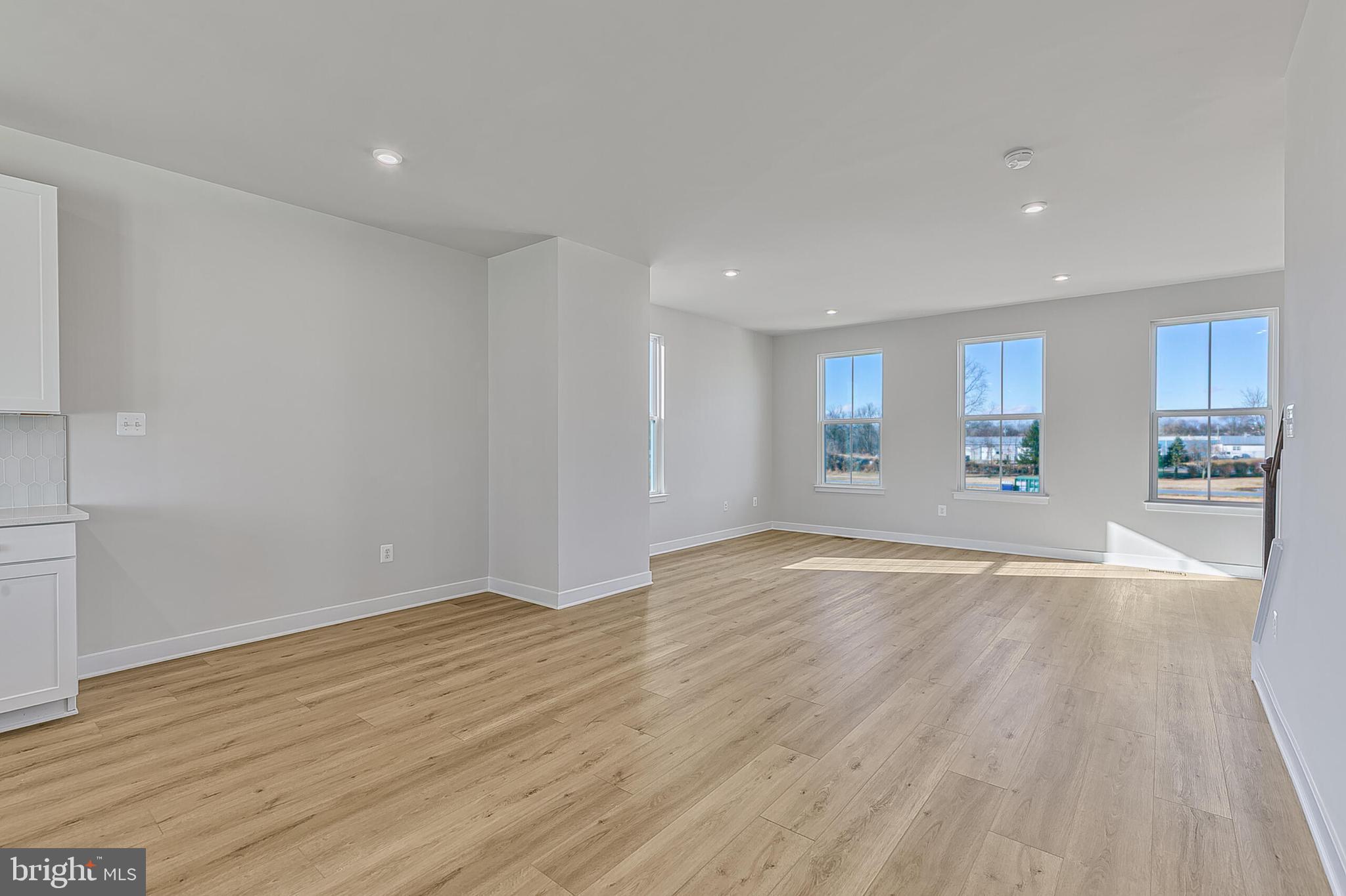 1 B Oasis Avenue Ranson, WV 25438 - Photo 22 of 39 a view of an empty room with wooden floor and a window