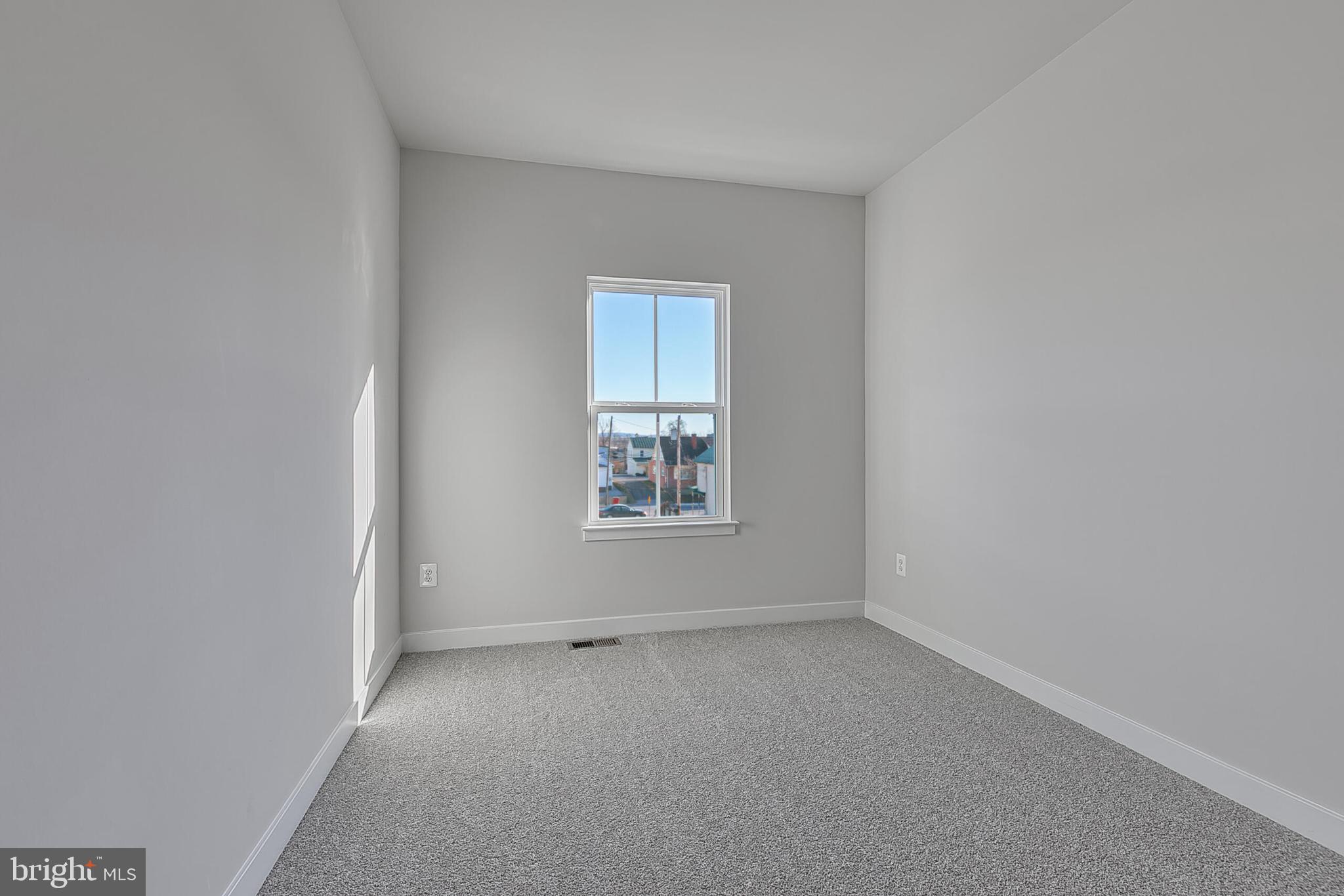 1 B Oasis Avenue Ranson, WV 25438 - Photo 29 of 39 an empty room with a window