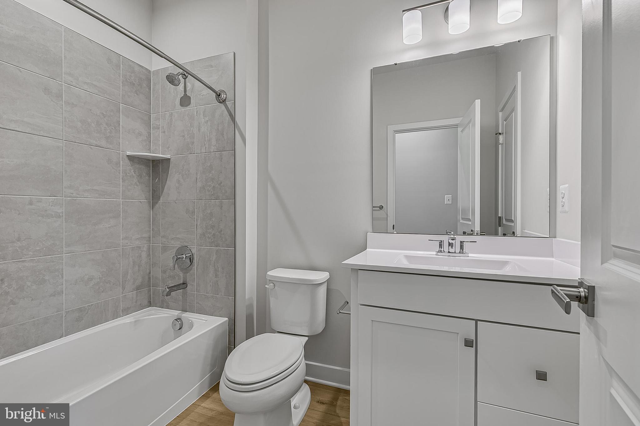 1 B Oasis Avenue Ranson, WV 25438 - Photo 31 of 39 a bathroom with a sink a toilet and shower