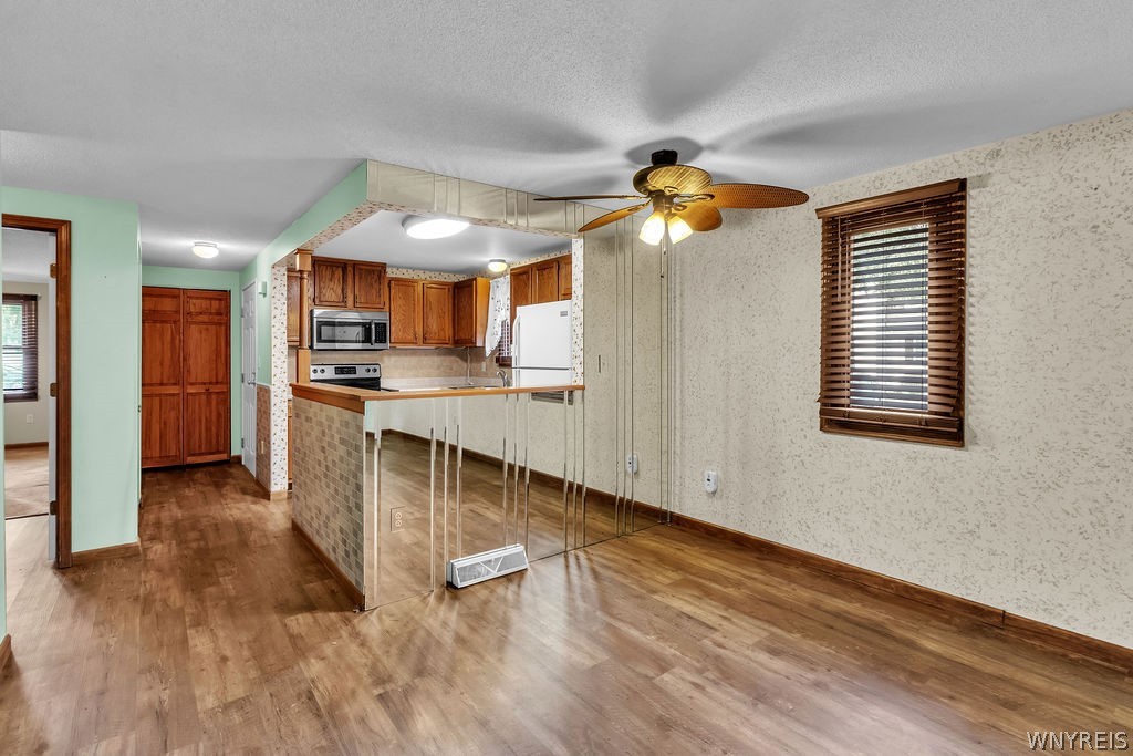 4755 Chestnut Ridge Road, Unit 9 Amherst, NY 14228 - Photo 22 of 46 Dinette/ living room area