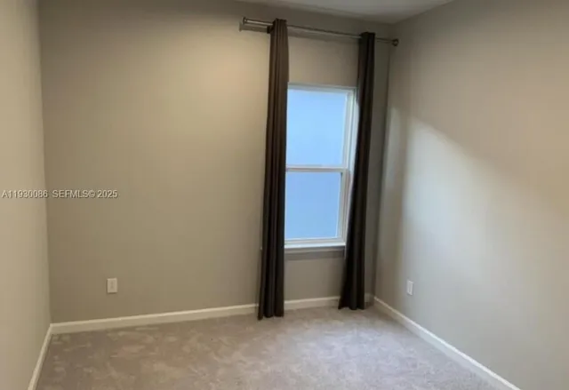 an empty room with mirror