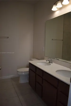 a bath tub sitting next to a white sink