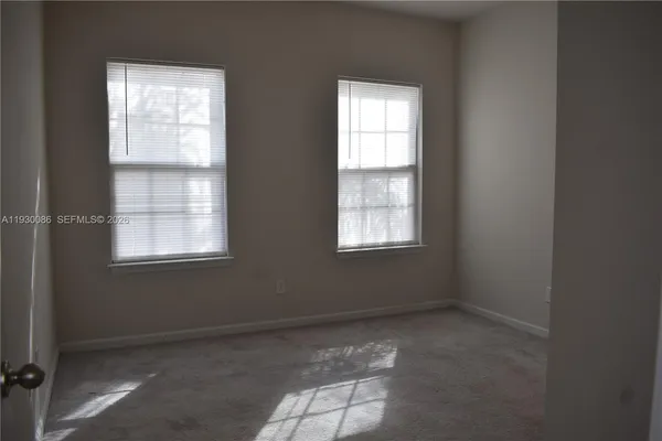 an empty room with closet area