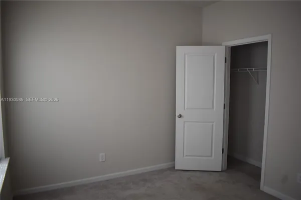 an empty room with closet