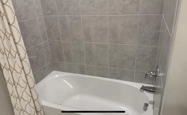 a close up of a bathtub in a bathroom